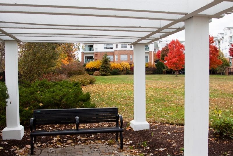 3 sitter aluminum chair under a sturdy pergola