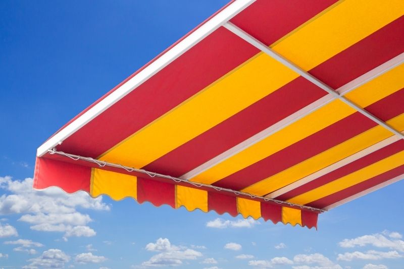 experienced professional with years of experience installing awnings